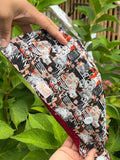 Hunter x Hunter–inspired scrub cap with a black, white, and red character collage, red satin lining, and white side button