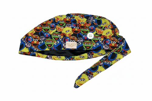 Sesame Street scrub cap side view with silky black lining and button loop